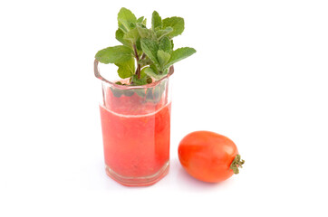 red tomato juice healthy diet with tomato and green mint isolated on white background.