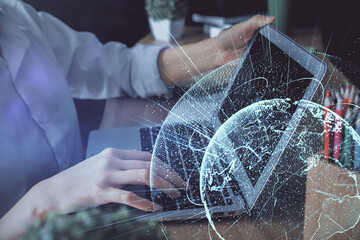 Double exposure of woman hands typing on computer and social network theme hologram drawing. People media concept.