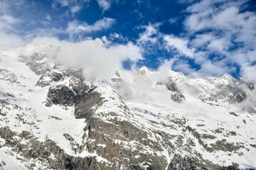 Fototapeta na wymiar Snow-covered mountains. View to Montblanc mountain from the Italian ski resort. 