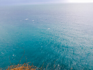 Genova, Italy - March 12, 2021 - Seascape, blue sky, clouds and sea in the tropical waters of the Mediterranean sea in winter days.