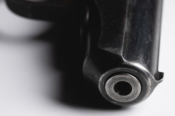 Old Soviet pistol. Close-up on white background
