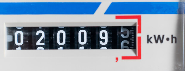 macro view of electricity watt meter, kilowatt calculator counter at home, savings economy