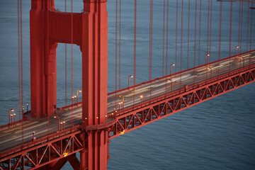 Detail of the Golden Gate Bridge in San Francisco - California - USA photographed in daylight. The cars are only visible as blurred light lines. 