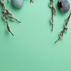 Happy Easter concept with easter eggs in nest and willows. Easter background.