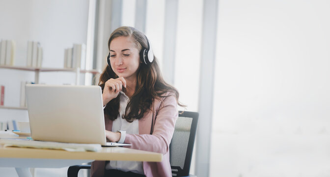 Mobile online working concept, Business woman in headphone working with computer laptop in office with copy space