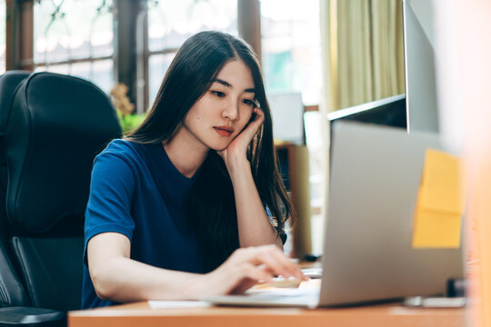 Young adult business freelancer asian woman working at home office.