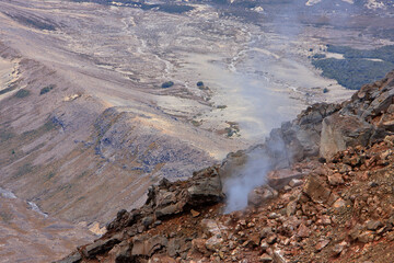Smoke and steam at a volcanos slope in New Zealand