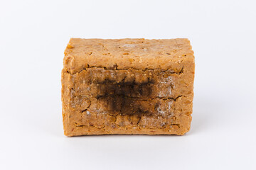 Meju front closeup on white background. Korean traditional fermented soybean food.