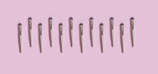 makeup brush on colored background