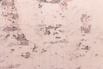 The wall of the house is with shabby, peeling plaster. ..