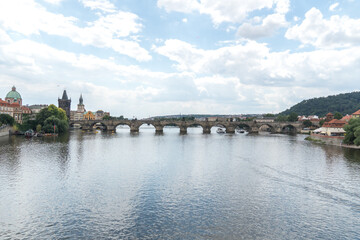 Fototapeta na wymiar Panoramic view of the Charles Bridge, a medieval stone arch bridge that crosses the Vltava (Moldau) river in Prague, Czech Republic