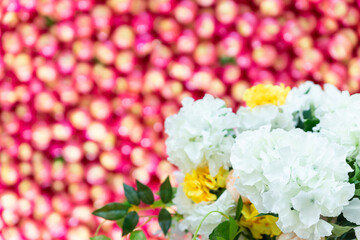 Beautiful bouquet background, white hydrangeas on a background of red apples, wedding decorations closeup