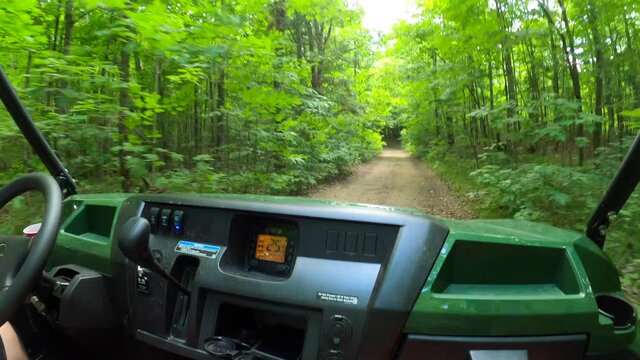utv side by side pov passenger seat driving in forest