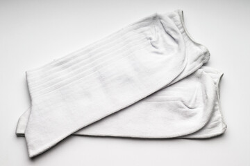 Fototapeta na wymiar Pair of white socks on white background
