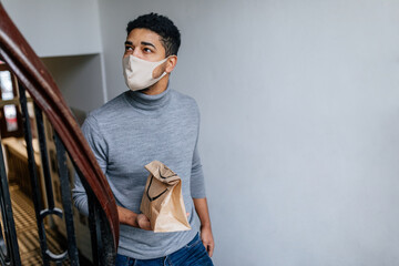 Man with face mask delivering food