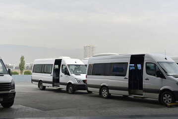 minibuses with open doors on city bus station © Oleksandr