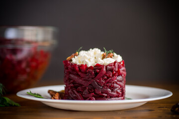 dietary salad of boiled beets with walnuts and cottage cheese