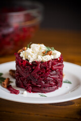 dietary salad of boiled beets with walnuts and cottage cheese