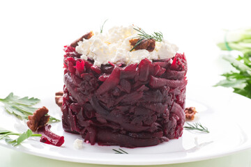 dietary salad of boiled beets with walnuts and cottage cheese
