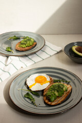 Avocado toast. Sliced bread with avocado.