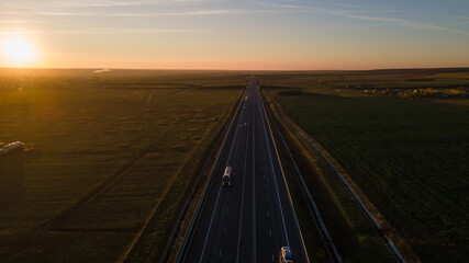 Fototapeta premium Drone image of a highway on a sunset