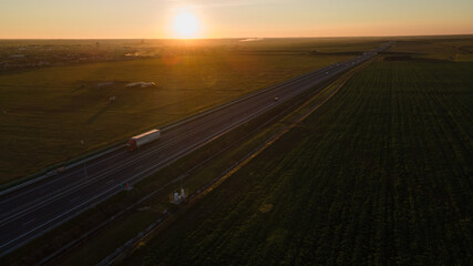 Drone image of a highway on a sunset