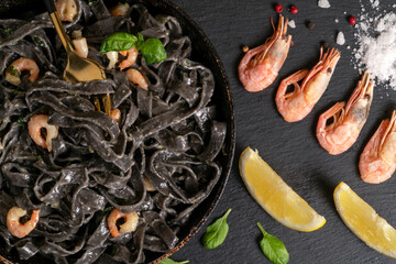 Fried prawns, shrimps, Italian black spaghetti, pasta