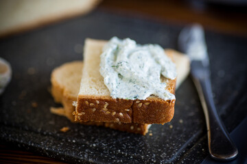 homemade salted curd spread with herbs and garlic