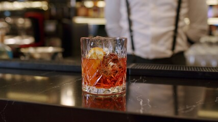 bartender mixing cocktail at bar