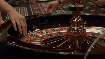 Roulette players place their bets