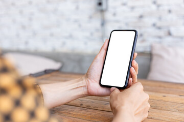 cell phone blank white screen mockup.woman hand holding texting using mobile on desk at office.background empty space for advertise.work people contact marketing business,technology