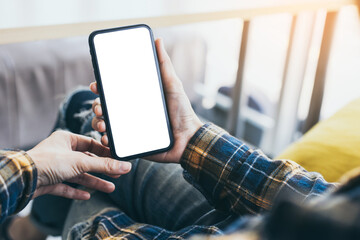 cell phone blank white screen mockup.woman hand holding texting using mobile on desk at office.background empty space for advertise.work people contact marketing business,technology