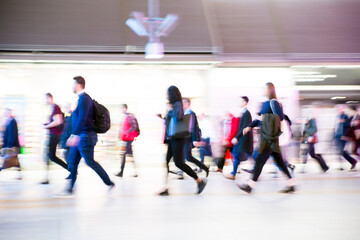 Illustration of walking people. Lots of people walking in the City of London. Wide panoramic view of people passing through abstract tunnel. People motion blur