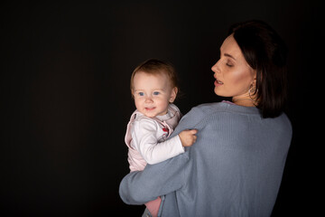 Beautiful young mother with her cute and happy daughter