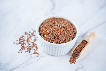 Healthy dried flax seeds in a bowl