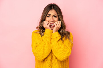 Young caucasian woman isolated biting fingernails, nervous and very anxious.