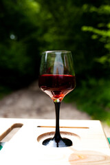 a large glass of red wine with splashes and bubbles. copy space,similar images