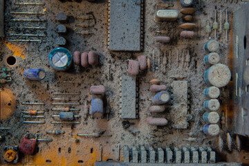 Old and very dusty electronic circute close up.