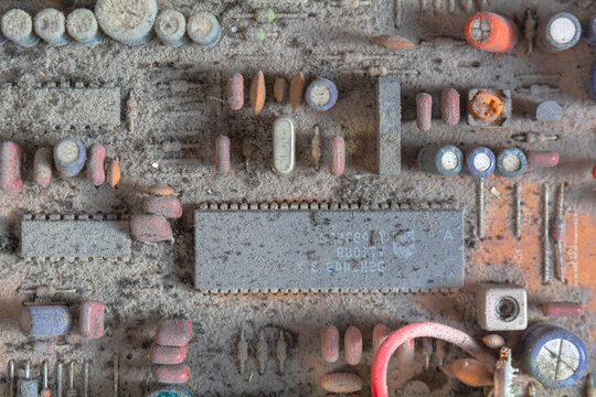 Old and very dusty electronic circute close up.