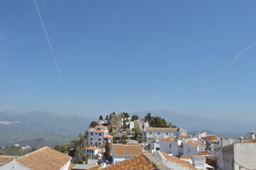 View of the white town of Comares with the Atalaya fortress a sunny day