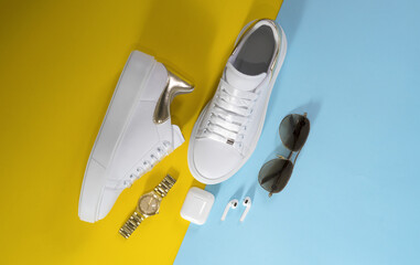 women's white sneakers with accessories on yellow and light blue background
