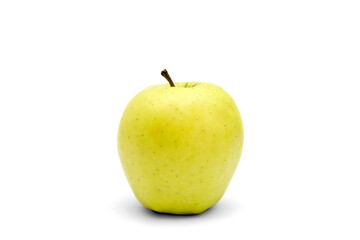 One whole golden delicious apple isolated on a white background