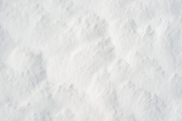 Fresh clean white snow background texture. Winter background with frozen snowflakes and snow mounds. Snow lumps. Seasonal landscape details. Cold weather.