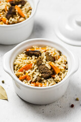 Beef and rice, side dish in pots. Space for text.