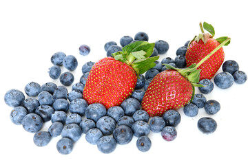 Ripe juicy strawberries and garden blueberries on white background