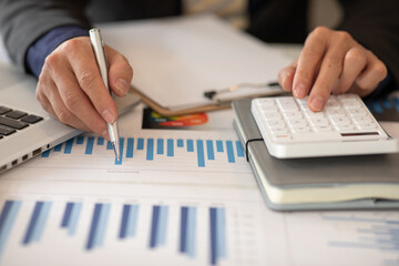  Businessmen are calculating income-expenditure and analyzing real estate investment data, Accounting Financial and tax systems concept.