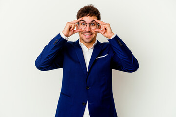Young business caucasian man isolated on white background keeping eyes opened to find a success opportunity.