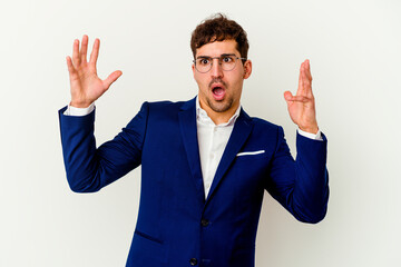 Young business caucasian man isolated on white background screaming to the sky, looking up, frustrated.