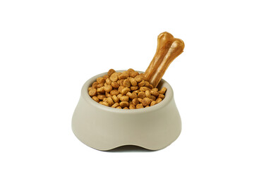 Dry dog food in bowl on white background