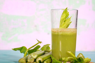 Healthy Celery diet for the treatment of incurable mysterious diseases. Fresh celery juice squeezed out on a juicer.drink, vegetable juice, studio shot